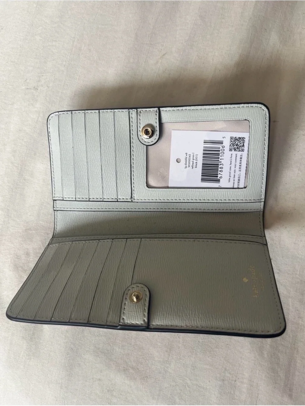 kate spade Black Pebbled Leather Zip-Around Wallet with Gold Logo